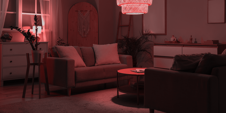 Contemporary living space with red accent lighting and modern decor