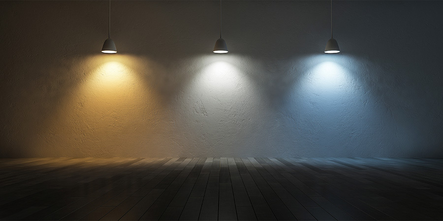 Correlated Color Temperature Lighting 3 hanging lamps with different color temperatures representing a scale. Cool white, neutral white, and warm white.