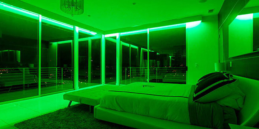 modern bedroom rgb green led strip lighting Modern bedroom with RGB green LED strip lighting along ceiling and large floor-to-ceiling windows.