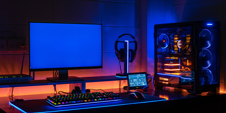 set-up-gamer-with-blue-led-lights-and-orange-rgb-strips-back-lights Set up gamer with blue and orange rgb strips lights.