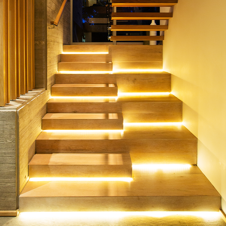 Warm white LED strip lighting design for the stairs